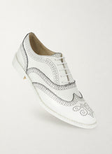 Black outline white brogue shoes, front three-quarter view - Luke Grant-Muller