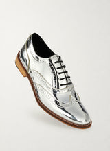 Mirror finish silver metallic brogue shoes, front three-quarter view - Luke Grant-Muller