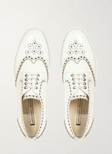 Patent white wingtip derby shoes with black brogueing, top view - Luke Grant-Muller