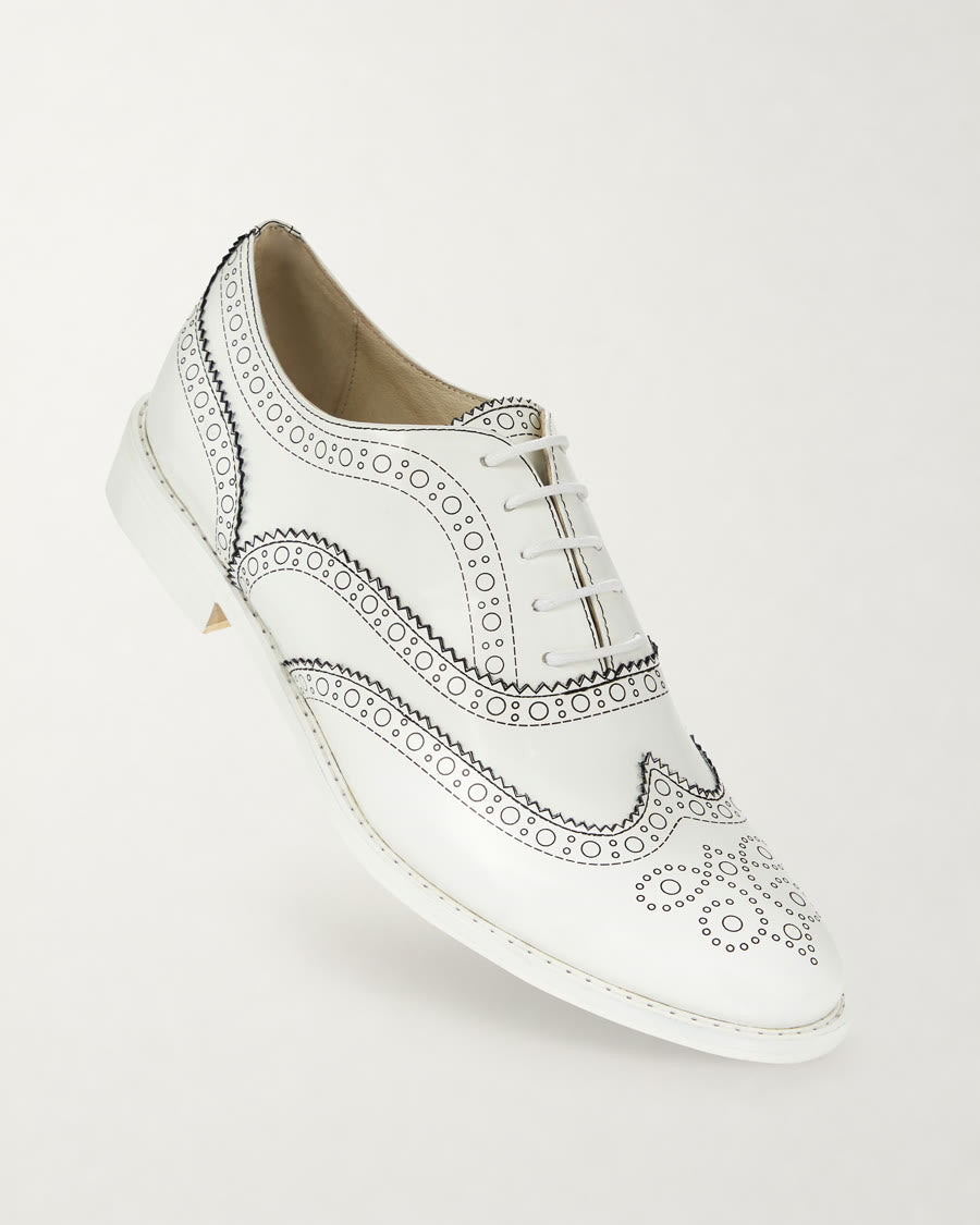 Black Outline White Brogue Shoes diagonal product view - Luke Grant-Muller